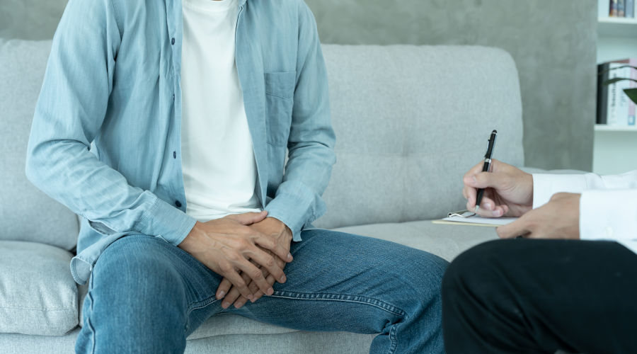 male patient discussing prostate problems with a doctor